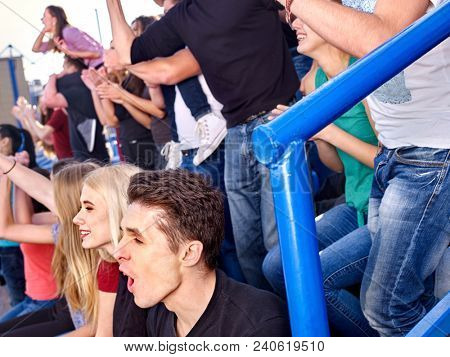 Fans cheering in stadium people applaud your favorite team and singing on tribunes. Group youth group support your favorite team. Approach to specific situation.