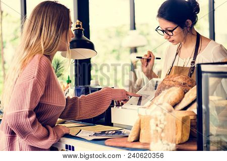 Customer ordering pasrty at counter