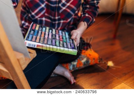 Female Artist Drawing With Pastel Chalk On Eagel Canvas