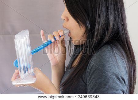 Patient Using Incentivespirometer Or Three Balls For Stimulate Lung,selective Focus