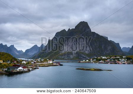 Mount Olstind And Reine Fishing Village On Lofoten Islands In Norway.