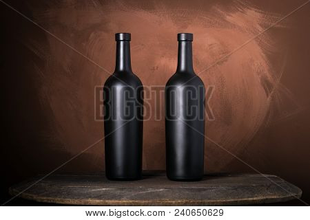 Red Wine Bottle On A Wooden Brown Background