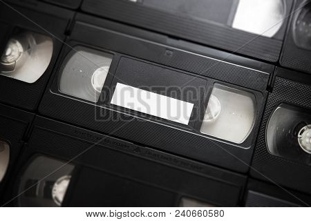 flatlay of  VHS or VCR Video cassette tape with blank white label.