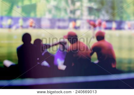 Playing Soccer Game On Sports Field, Football Match On Pitch. Siluets Of Fans, Players Football Outd