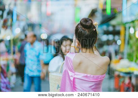Young Woman Dressed In Thai Costume Take A Photo