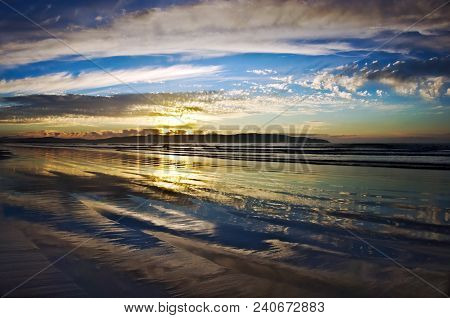 A Stunning Sunset With Reflections On Benone Beach,ireland.