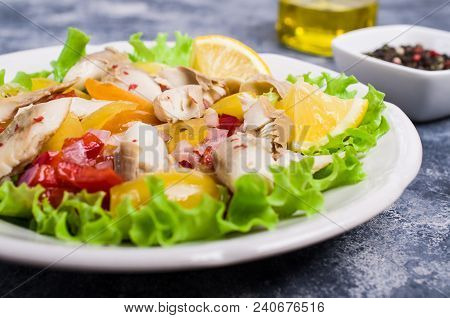 Fish Fillet With Raw Vegetables And Lemon In A Dish On The Table. Selective Focus.