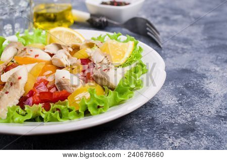 Fish Fillet With Raw Vegetables And Lemon In A Dish On The Table. Selective Focus.