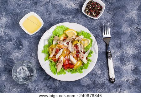 Fish Fillet With Raw Vegetables And Lemon In A Dish On The Table. Selective Focus.