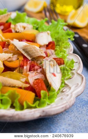 Fish Fillet With Raw Vegetables And Lemon In A Dish On The Table. Selective Focus.