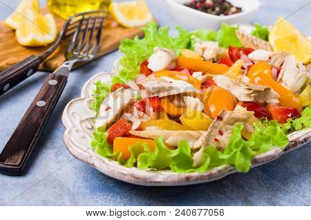 Fish Fillet With Raw Vegetables And Lemon In A Dish On The Table. Selective Focus.