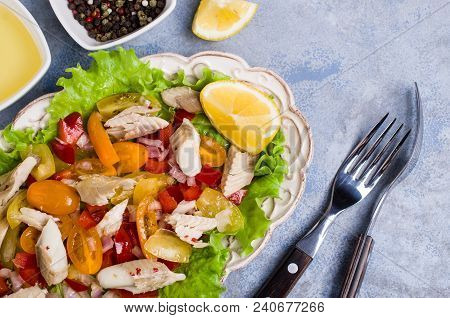 Fish Fillet With Raw Vegetables And Lemon In A Dish On The Table. Selective Focus.