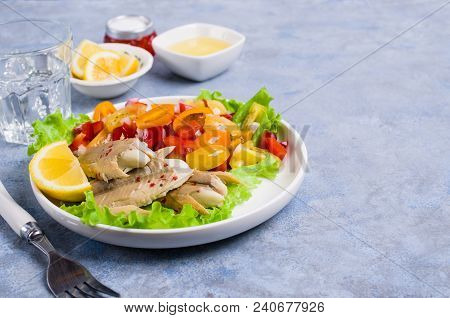 Fish Fillet With Raw Vegetables And Lemon In A Dish On The Table. Selective Focus.