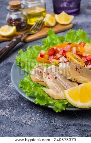 Fish Fillet With Raw Vegetables And Lemon In A Dish On The Table. Selective Focus.