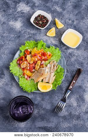 Fish Fillet With Raw Vegetables And Lemon In A Dish On The Table. Selective Focus.