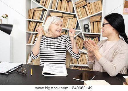 Excellent Progress. Jovial Senior Woman Smiling While Tutor Clapping