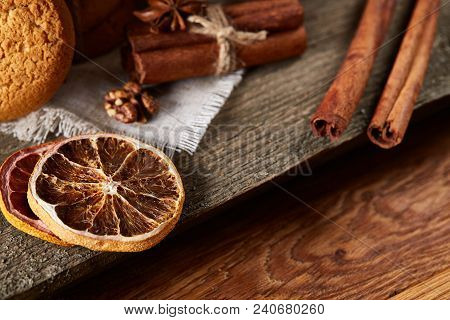 Traditional Christmas Tea Concept With A Large Set Of Cookies On A Homespun Napkin, Cinnamon Sticks 
