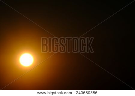 A Bright Sun Or Moon In The Coner On A Dark Sky. Designer Background