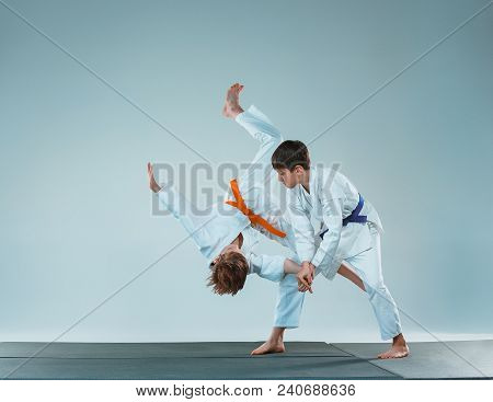 The Teen Boys Fighting At Aikido Training In Martial Arts School. Healthy Lifestyle And Sports Conce