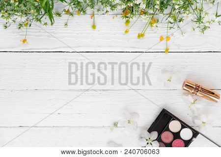 Fresh Flowers, Decorative Cosmetics On A Wooden Background