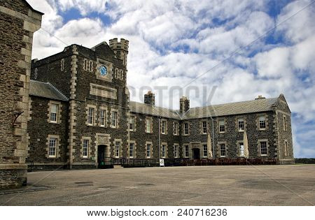 Falmouth, Cornwall, Uk - April 12 2018: Imposing Grey Stone Guardhouse And Other Military Buildings 