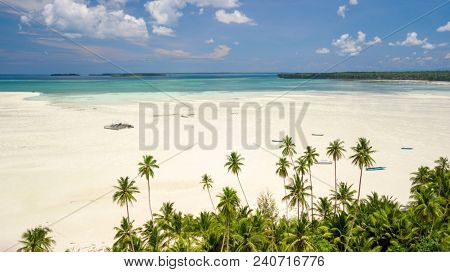 Aerial shot of deserted tropical Ohoidertawun beach with vast area of white sand, Kei Kecil island, Maluku, Indonesia