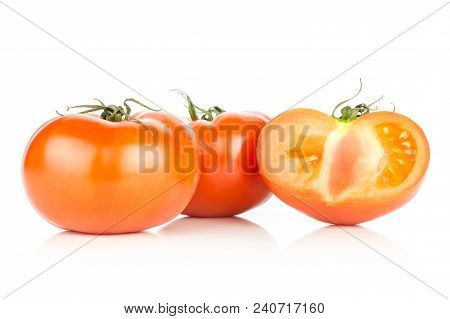 Two Red Tomato And One Sliced Half Isolated On White Background