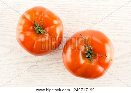 Two Red Tomato Isolated On Grey Wood Background Top View