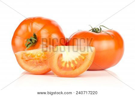 Two Red Tomatoes And Two Slices Isolated On White Background Fresh