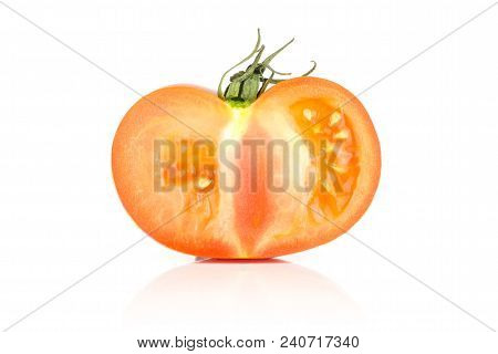 One Red Tomato Section Half With Seeds Isolated On White Background
