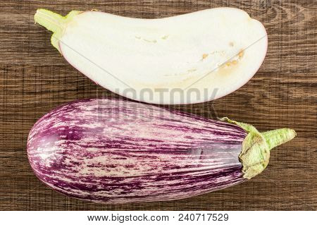 Striped Purple Eggplant Collection Top View Isolated On Brown Wood Background One Whole And Sliced S