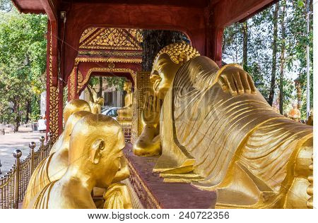 Close-up Of Buddha Lying Down And Monks Worshiping Him Complex Temple Temp Wat Kraom. Sihanokville C