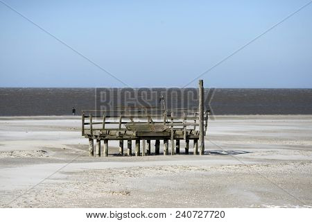 A Cold And Clear Windy Day At The Big Beach With A Wood Construction. Sankt Peter Ording In The Germ