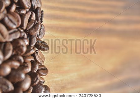 Beautiful Fried Coffee Beans On A Light Wooden Background, On The Left. Background, Wallpaper