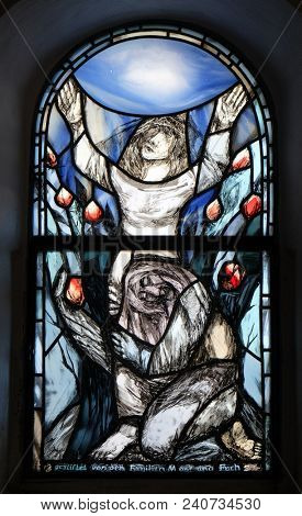 HUTTEN, GERMANY - JULY 04: Stained glass window by Sieger Koeder in chapel in Hutten, Germany on July 04, 2017.