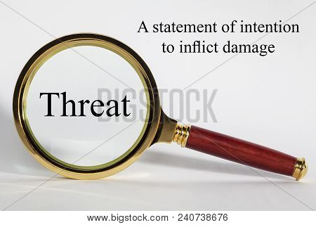 Threat  Concept - Looking At Threat Through A Magnifying Glass, And Definition.