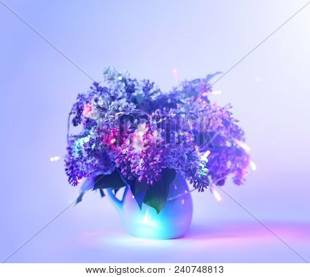 Beautiful Bouquet Of Fragrant Purple Flowers In Blue Ceramics Vase On Light Background With Festive 