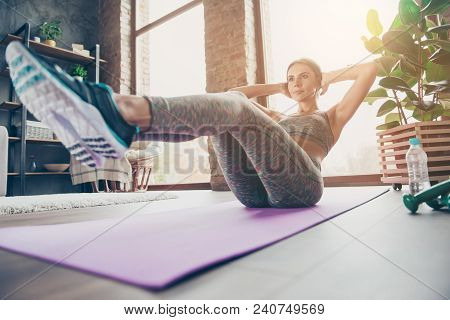 Low-angle Photo Of Attractive Sportive Pretty Strong Muscular Flexible Woman Doing Sit-ups And Holdi