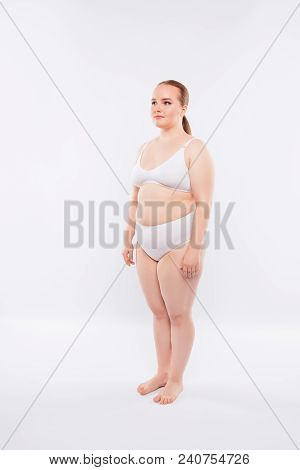 Half-turned Full-size, Full-length Photo Of Obese Fatty Model Leading Unhealthy Lifestyle, Wearing W