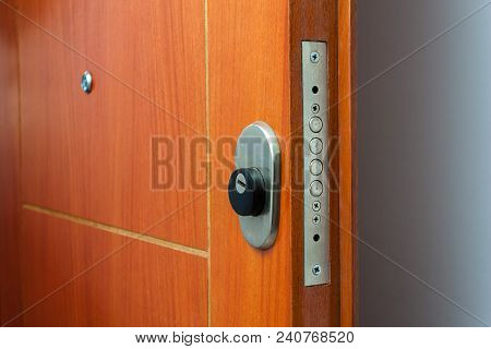 Open Door Of A Family Home. Close-up Of The Lock An Armored Door. White Background.