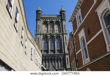 Looking Up At The Tower Of St. Botolphs Church In The Market Town Of Colchester In Essex, Uk.