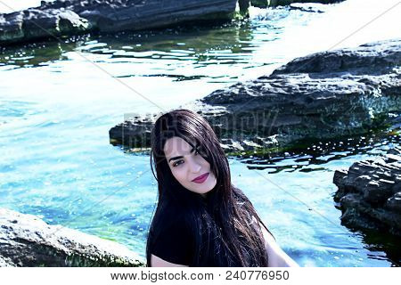 Happy Woman On The Beach. Portrait Of A Beautiful Girl Close-up. Spring Portrait On The Beach. Young