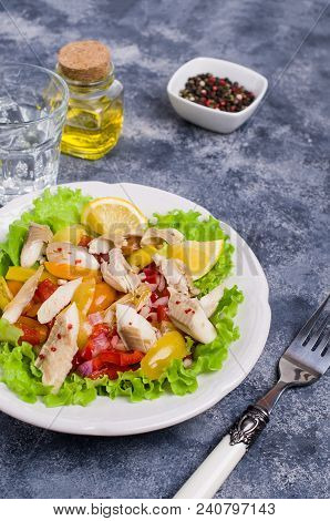 Fish Fillet With Raw Vegetables And Lemon In A Dish On The Table. Selective Focus.