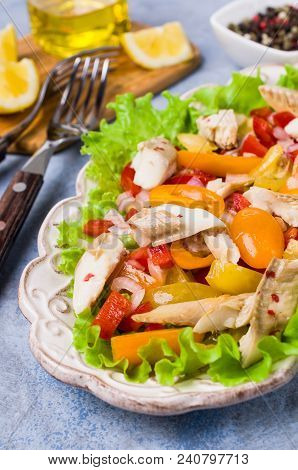 Fish Fillet With Raw Vegetables And Lemon In A Dish On The Table. Selective Focus.