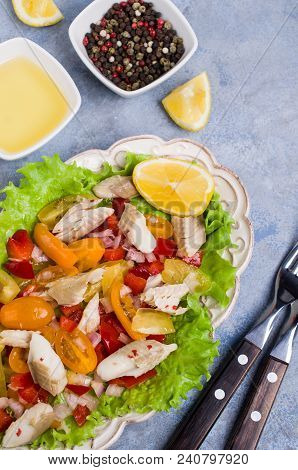 Fish Fillet With Raw Vegetables And Lemon In A Dish On The Table. Selective Focus.