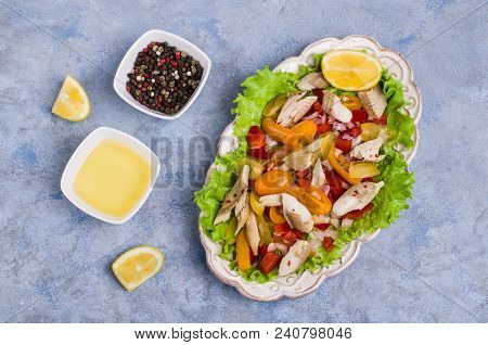 Fish Fillet With Raw Vegetables And Lemon In A Dish On The Table. Selective Focus.