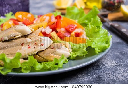 Fish Fillet With Raw Vegetables And Lemon In A Dish On The Table. Selective Focus.