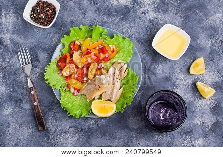 Fish Fillet With Raw Vegetables And Lemon In A Dish On The Table. Selective Focus.