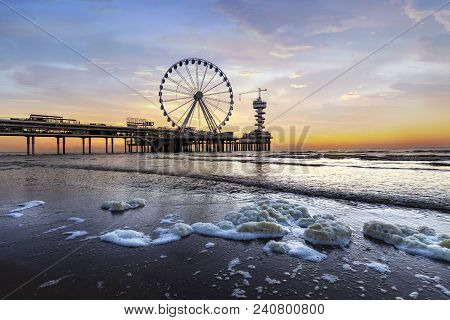 Landscape Of A Sunset At The Beach And The Pier Of Scheveningen With Nobody, No Tourists, The Hague,