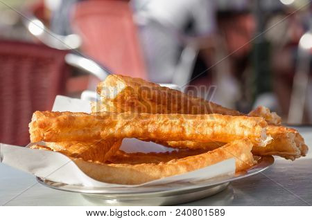 Typical Spanish Snack Churros Are Deep-fried Pastries  And Served With Hot Chocolate Everywhere In S